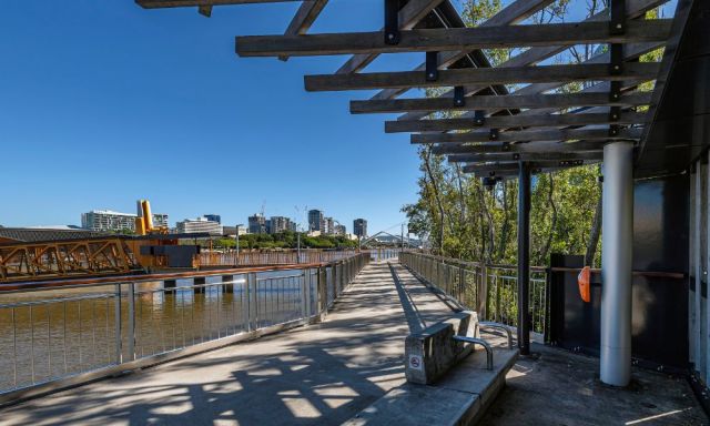 The mangrove walkway and nearby ferry terminal on a sunny day.